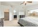 A bright bedroom with large window, ceiling fan, and ensuite bathroom and walk-in closet at 8867 E Avenida Las Noches --, Gold Canyon, AZ 85118