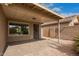 A covered patio with stone floors, provides a relaxing spot for outdoor enjoyment at 8867 E Avenida Las Noches --, Gold Canyon, AZ 85118