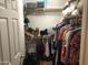 Walk-in closet with organized shelving, hanging rods, and ample storage space at 8870 N 48Th Ln, Glendale, AZ 85302