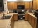 Modern kitchen featuring ample counter space and storage solutions, with updated appliances at 8870 N 48Th Ln, Glendale, AZ 85302