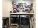 Laundry room features modern washer and dryer set and shelving at 8870 N 48Th Ln, Glendale, AZ 85302
