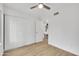 Bright bedroom with ample closet space and a ceiling fan, perfect for comfortable living at 9036 N 51St Ln, Glendale, AZ 85302