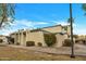Attractive single story home featuring a well-kept lawn and desert-friendly plantings at 9036 N 51St Ln, Glendale, AZ 85302