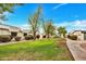 Landscaped green space with mature trees and manicured lawns, enhancing the community's curb appeal at 9036 N 51St Ln, Glendale, AZ 85302