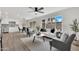 Bright living room features neutral colors, modern furnishings, and seamless flow to the kitchen at 9036 N 51St Ln, Glendale, AZ 85302