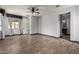 Large bedroom with wood-look flooring, ceiling fan, and walk-in closet access at 9302 W Georgia Ave, Glendale, AZ 85305