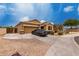 Beautiful single-story home with desert landscaping, two-car garage, and extended driveway at 9302 W Georgia Ave, Glendale, AZ 85305