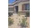 Charming home featuring desert landscaping and an attractive stucco exterior with stacked stone accents at 9302 W Georgia Ave, Glendale, AZ 85305
