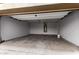 Spacious two car garage with ample room for storage and overhead lighting at 9302 W Georgia Ave, Glendale, AZ 85305