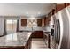 Well-equipped kitchen featuring stainless steel appliances, granite countertops, and plenty of storage at 9302 W Georgia Ave, Glendale, AZ 85305
