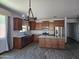 Modern kitchen with stainless steel appliances, white subway tile backsplash and a spacious island at 9302 W Georgia Ave, Glendale, AZ 85305