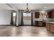Open-concept kitchen featuring stainless steel appliances, a tile backsplash, and lots of natural light at 9302 W Georgia Ave, Glendale, AZ 85305