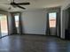 Inviting living room with lots of natural light, neutral walls, and sliding door access to the backyard at 9302 W Georgia Ave, Glendale, AZ 85305