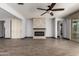 Bright living room with tiled floors, fireplace, and access to outdoor living space at 9302 W Georgia Ave, Glendale, AZ 85305