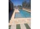 The outdoor space features a beautiful pool with a tanning ledge, perfect for soaking up the sun at 9302 W Georgia Ave, Glendale, AZ 85305