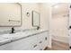 Bathroom featuring double sinks, granite countertops, modern fixtures, and a shower-over-tub combo at 9431 E Coralbell Ave # 60, Mesa, AZ 85208