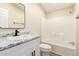 A modern bathroom includes a single sink vanity and a shower-over-tub at 9431 E Coralbell Ave # 60, Mesa, AZ 85208