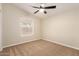 Inviting bedroom with a ceiling fan, a window for natural light, and cozy carpet for comfort at 9431 E Coralbell Ave # 60, Mesa, AZ 85208