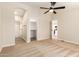 Large bedroom with ceiling fan leads to an ensuite bathroom and a walk-in closet for ample storage at 9431 E Coralbell Ave # 60, Mesa, AZ 85208