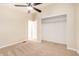 Bedroom with closet and ensuite doorway, carpet, and ceiling fan at 9431 E Coralbell Ave # 60, Mesa, AZ 85208