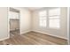 Well-lit bedroom featuring wood-look floors and a double window letting in natural light at 9431 E Coralbell Ave # 60, Mesa, AZ 85208