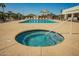 Community hot tub next to a community pool, with lots of lounge chairs at 9431 E Coralbell Ave # 60, Mesa, AZ 85208