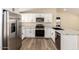 Modern kitchen featuring stainless steel appliances and white cabinets at 9431 E Coralbell Ave # 60, Mesa, AZ 85208