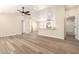 Inviting open-concept living room with modern floors seamlessly flowing into the kitchen at 9431 E Coralbell Ave # 60, Mesa, AZ 85208