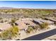 Aerial view of the property showcasing the house, landscaping, and golf course at 9560 E Preserve Way, Scottsdale, AZ 85262