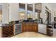 Stylish bar area featuring dark countertops, wine fridge, and ample storage, ideal for entertaining guests at 9560 E Preserve Way, Scottsdale, AZ 85262