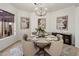 Elegant dining room showcasing a round table, chandelier, neutral decor, and sophisticated ambiance at 9560 E Preserve Way, Scottsdale, AZ 85262