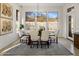Bright dining area with large windows offering views and a modern chandelier above the table at 9560 E Preserve Way, Scottsdale, AZ 85262