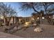 Desert landscaping highlights this single story home with stacked tile roof and arched windows and entry at 9560 E Preserve Way, Scottsdale, AZ 85262