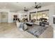 Open-concept living area with high ceilings, ceiling fans, and access to the outdoor patio at 9560 E Preserve Way, Scottsdale, AZ 85262