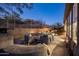 Relaxing outdoor living space with comfortable seating, ambient lighting, and a view of the pool at 9560 E Preserve Way, Scottsdale, AZ 85262