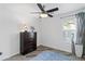 Bedroom featuring ceiling fan, wood-look flooring, and natural lighting at 974 E Palomino Way, San Tan Valley, AZ 85143