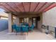 Inviting covered patio with comfortable seating, ideal for outdoor relaxation and entertaining at 974 E Palomino Way, San Tan Valley, AZ 85143
