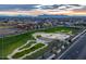 Aerial view of community featuring a modern skate park and neighborhood homes with mountain views at 9821 E Supernova Dr, Mesa, AZ 85212