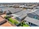 Aerial view of the property showing backyard, covered patio, and tile roof at 9821 E Supernova Dr, Mesa, AZ 85212