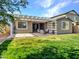 Beautiful backyard featuring a covered patio and a lush green lawn at 9821 E Supernova Dr, Mesa, AZ 85212