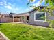 Backyard featuring lush green lawn with plenty of room to relax or play at 9821 E Supernova Dr, Mesa, AZ 85212