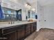 This bathroom boasts an expansive countertop and sleek dark wood cabinetry at 9821 E Supernova Dr, Mesa, AZ 85212