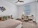 This cozy bedroom includes a desk and plenty of natural light at 9821 E Supernova Dr, Mesa, AZ 85212