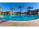 Community pool with seating for relaxation and water basketball at 9821 E Supernova Dr, Mesa, AZ 85212