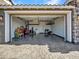 Spacious garage with epoxy flooring, providing secure parking and storage at 9821 E Supernova Dr, Mesa, AZ 85212