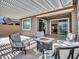 Inviting outdoor patio with comfortable seating, a fire pit, and views of the backyard at 9821 E Supernova Dr, Mesa, AZ 85212