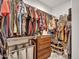 This walk-in closet provides ample storage solutions with rods, shelves, and drawers at 9821 E Supernova Dr, Mesa, AZ 85212