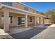 An inviting covered back patio area featuring an elegant design with gray gravel at 1012 E Rosebud Dr, San Tan Valley, AZ 85143