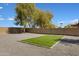 Backyard featuring a gravel landscape and a rectangular plot of turf, ideal for relaxation and outdoor activities at 1012 E Rosebud Dr, San Tan Valley, AZ 85143