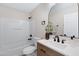 Bathroom with shower-tub combo, single-sink vanity, and bronze fixtures at 1012 E Rosebud Dr, San Tan Valley, AZ 85143